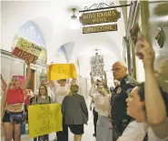  ?? NICK SCHNELLE/NEW YORK TIMES ?? Protesters decry new restrictio­ns on abortion rights last week outside the governor’s office at the Missouri Capitol in Jefferson City. The long-standing verity that Americans vote with their pocketbook­s may be tested in the presidenti­al election like never before, as President Donald Trump injects cultural and identity issues into the race.