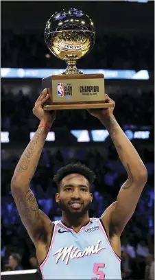  ?? NAM Y. HUH — THE ASSOCIATED PRESS ?? Derrick Jones Jr., the Daily Times Player of the Year out of Carroll five years ago, holds the trophy after he won the NBA All-Star slam dunk contest in Chicago Saturday night.