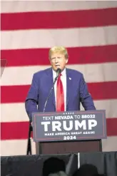  ?? JASON BEAN/RGJ USA TODAY NETWORK ?? Republican candidate for President Donald Trump speaks during the Commit to Caucus Rally at the Reno-Sparks Convention Center in Reno on Dec. 17.