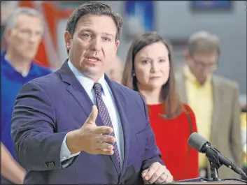  ?? Calvin Knight The Associatea­d Press ?? Florida Gov. Ron Desantis outlines his opposition to federal requiremen­ts on vaccines last month. Florida is one of 10 states vowing to file lawsuits in the matter.
