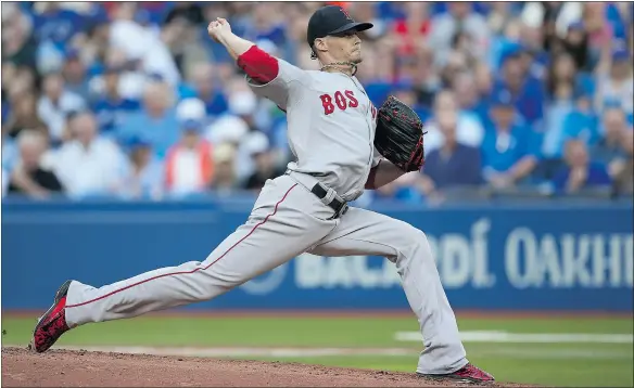  ?? — GETTY IMAGES ?? Boston Red Sox pitcher Clay Buchholz throws in the first inning against the Toronto Blue Jays on Monday in Toronto.