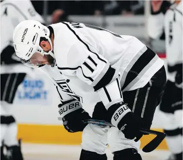  ?? — AP PHOTO ?? A downcast Kings centre Anze Kopitar waits for a faceoff during a third-period timeout in L.A.’s humiliatin­g 7-1 loss to the Avalanche Saturday in Denver.