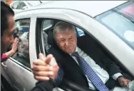  ?? PEDRO PARDO / AGENCE FRANCE-PRESSE ?? Andres Manuel Lopez Obrador, Mexico’s president-elect, shakes hands with a supporter in Mexico City on Monday.