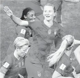  ?? FRANCOIS MORI/AP ?? Sam Mewis is in the center of the celebratio­n after scoring for the US against Thailand.