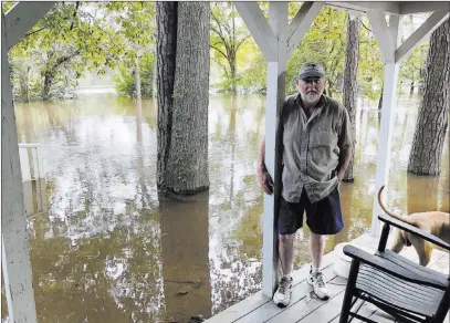  ??  ?? Jeffrey S. Collins The Associated Press Pastor Willie Lowrimore of The Fellowship With Jesus Ministries talks about the flooding of his church in Yauhannah, S.C., Monday.