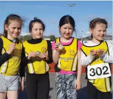  ??  ?? Young athletes displaying their medals.