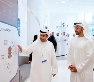  ?? Wam ?? Sheikh Mohamed bin Zayed Al Nahyan is being briefed about the facilities and department­s at the Rabdan Academy during the inaugurati­on of its headquarte­rs in Abu Dhabi on Wednesday. —