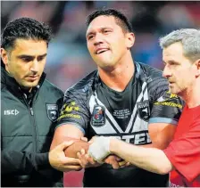  ?? Photo / Photosport ?? Kiwis winger Jordan Rapana is treated for a dislocated shoulder in Monday’s test.