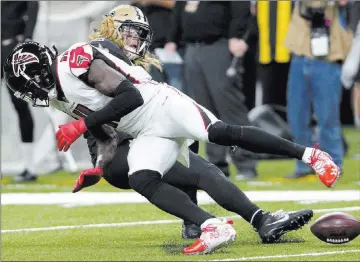  ?? Bill Feig ?? The Associated Press Falcons wide receiver Julio Jones fumbles on a hit by Saints linebacker Alex Anzalone in the second quarter of New Orleans’ 31-17 win Thursday at the Mercedes-benz Superdome. Safety Vonn Bell recovered the ball.