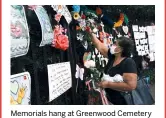  ??  ?? Memorials hang at Greenwood Cemetery to remember and celebrate the lives of those killed in the COVID-19 pandemic