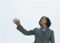  ??  ?? TAIWANESE PRESIDENT Tsai Ing-wen waves as she boards the domestical­ly built 600-ton ‘Tuo Jiang’ twin-hull stealth missile corvette at Suao Naval Base in Yilan yesterday.