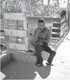  ?? EMILIO ESPEJEL/AP ?? Honduran migrant Wilmer, 15, who is traveling with his father, sits inside a Mexican shelter trying to reach the U.S.