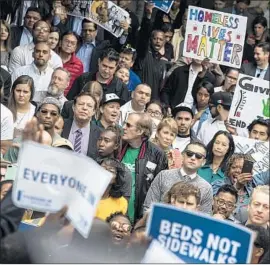  ??  ?? THE RALLY showed support from L.A.’s neighborho­ods, Bonin says. Temporary shelters are to be built in all 15 council districts, with the first in Koreatown.