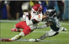  ?? ASHLEY LANDIS — THE ASSOCIATED PRESS ?? Kansas City Chiefs wide receiver Juju Smith-schuster (9) falls to the turf against Philadelph­ia Eagles cornerback Avonte Maddox during the second half of the Super Bowl last month in Glendale, Ariz.