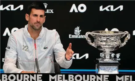  ?? Dita Alangkara / Associated Press ?? Novak Djokovic gestures during a press conference following his win over Stefanos Tsitsipas in the men's singles final at the Australian Open on Sunday.