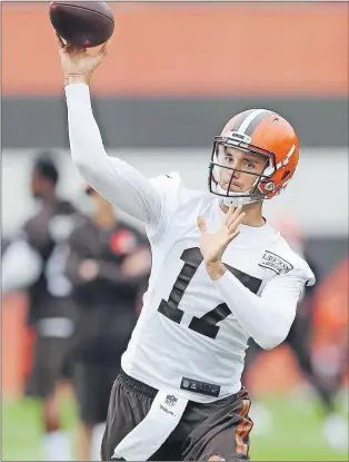  ?? AP PHOTO ?? Cleveland Browns quarterbac­k Brock Osweiler throws a pass during NFL practice May 2 in Berea, Ohio.