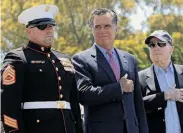  ?? Mary Altaffer / Associated Press ?? Mitt Romney (center), San Diego veteran of the year Marine David Dickey and Sen. John McCain appear at a Memorial Day ceremony in San Diego.