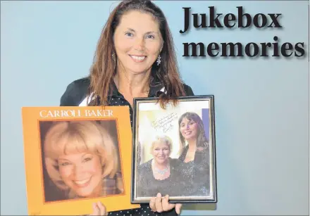  ?? SALLY COLE/SALTWIRE NETWORK ?? Fan Jolee Patkai shows some of her Carroll Baker memorabili­a. The P.E.I. singer-songwriter has been invited to sing two songs with Baker at her Sept. 22 concert.