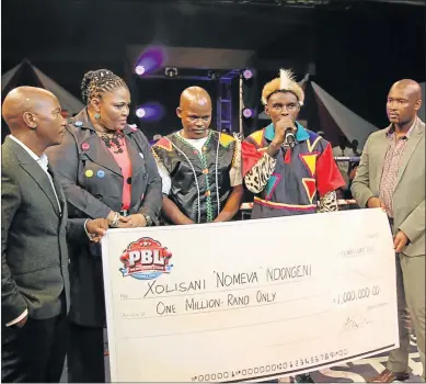 ?? Picture: SINO MAJANGAZA ?? CHEQUE TELLS THE STORY: Xolisani Ndongeni, second from right, is still waiting for his R1-million prize money. He is now ready to sue Dicksy Ngqula, left, for the money. Also in the picture are MEC Pemmy Majodina, Mzamo Njekanye and Mabutho Zwane