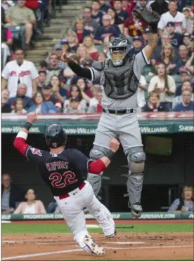  ?? PHIL LONG — THE ASSOCIATED PRESS ?? The Indians’ Jason Kipnis slides safely into home as White Sox catcher Omar Narvaez reaches for a high throw during the first inning.