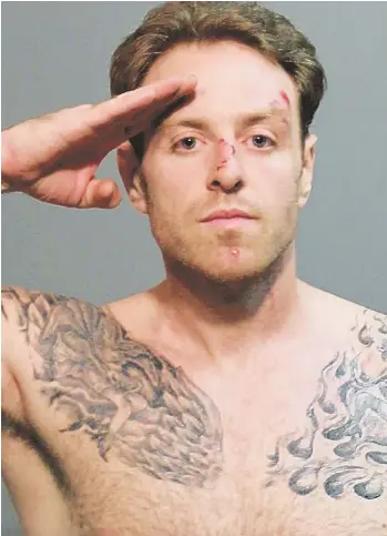  ?? SUFFOLK DISTRICT ATTORNEY'S OFFICE PHOTO ?? SALUTE: Joseph M. Parker poses for his mugshot in the Revere Police Station after he was arrested during an alleged assault on police officers at a traffic constructi­on site yesterday morning.