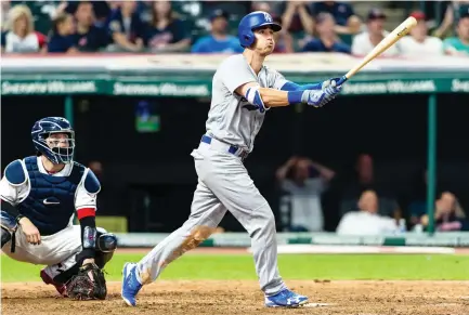  ??  ?? Cody Bellinger of the Los Angeles Dodgers hits a three run home run during the ninth inning against the Cleveland Indians at Progressiv­e Field in Cleveland, Ohio, on Tuesday night. (AFP)