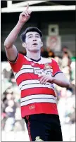  ??  ?? GOING UP: Doncaster marksman John Marquis