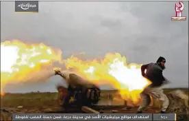  ?? ARMY OF ISLAM ?? In a photo posted Sunday by the Syrian rebel group Army of Islam, a fighter fires artillery against government forces in Daraa. The caption on the photo reads: “Targeting Assad’s militias in the city of Daraa, part of the Anger Campaign for Ghouta.”