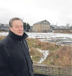  ?? Picture: David Wardle ?? David Henderson at the derelict land on which Lidl will build their new supermarke­t.