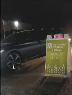  ?? ASSOCIATED PRESS ?? DoorDash drivers line up outside the Northern Illinois Food Pantry for their pickups, Nov. 10, in Park City, Ill.