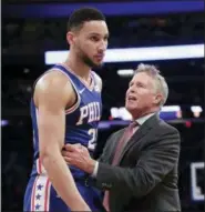  ?? FRANK FRANKLIN II — THE ASSOCIATED PRESS ?? Philadelph­ia 76ers head coach Brett Brown, right, talks to Philadelph­ia 76ers’ Ben Simmons (25) during the second half of an NBA basketball game against the New York Knicks Thursday.