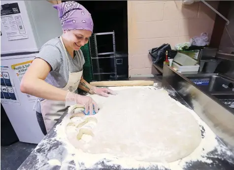  ?? PHOTOS: DAN JANISSE ?? Jordynne Ropat, owner of Plant Joy, makes vegan paczkis at the Little Foot Foods restaurant in Windsor on Monday, just in time for the area’s popular Paczki Day tradition on Tuesday. Local bakers are expecting huge demand for paczkis with a modern twist.
