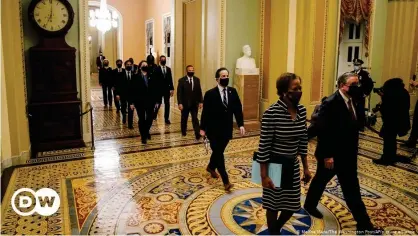  ??  ?? Clerk of the House Cheryl Johnson along with acting House Sergeant-at-Arms Tim Blodgett lead the Democratic House impeachmen­t managers as they walk through the Capitol Hill