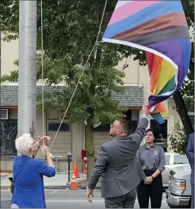  ?? PHOTO BY CARL HESSLER JR. ?? Montgomery County officials and members of the LGBTQI+ community raised the Progress Pride Flag at the county courthouse to celebrate Pride Month.
