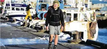  ??  ?? Josh Hicks arrives at Peterhead Harbour on his walk around the British coast