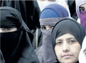  ?? ALLEN MCINNIS/POSTMEDIA NETWORK ?? About 120 people attended a protest in Montreal in April to express their opposition to a law banning face veils, saying the legislatio­n reflects cultural xenophobia and has no place in Quebec society.