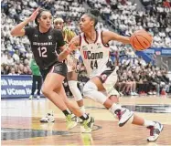  ?? Tyler Sizemore/Hearst Connecticu­t Media ?? UConn’s Aubrey Griffin (44) drives to the basket against No. 1 South Carolina at the XL Center in Hartford.