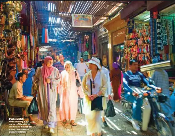  ??  ?? Pocket watch! When travelling in the markets of Marrakech – infamous for pickpocket­s – it pays to know what precaution­s to take