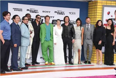  ?? ?? (From left to right) Logan Lerman, Masi Oka, Hiroyuki Sanada, Brian Tyree Henry, Bad Bunny, Brad Pitt, Joey King, Aaron Taylor-Johnson, Zazie Beetz, David Leitch, Kelly McCormick and Andrea Munoz attend the Los Angeles Premiere Of Columbia Pictures’ “Bullet Train” at Regency Village Theatre. — AFP