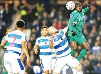  ??  ?? Watford’s Ken Sema (right), heads the ball past Queens Park Rangers’ Toni Leistner during the English FA Cup 5th round soccer match between Queens Park Rangers and Watford at Loftus Road Stadium in London on Feb15. (AP)