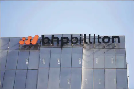  ??  ?? The BHP Billiton logo is mounted on the exterior of the company’s headquarte­rs in Melbourne. BHP is trying to establish itself as a leader in climate-change management after chief executive Andrew Mackenzie in July pledged to spend $400mn on curtailing emissions.