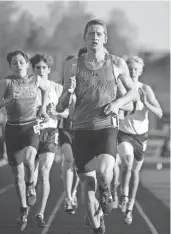  ?? MICHAEL MCLOONE / FOR THE JOURNAL SENTINEL ?? Cole Sandvold of Arrowhead leads the 1,600-meter race. He finished first in 4:30.51.