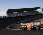  ?? PETER DEJONG — THE ASSOCIATED PRESS ?? F1driver Max Verstappen drives his car March 4through one of the two banked corners during a test and official presentati­on of the renovated F1track in Zandvoort,