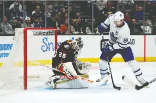  ?? KIRBY LEE/USA TODAY SPORTS ?? Captain John Tavares and the rest of the Toronto Maple Leafs are struggling to score, as seen here during a 2-1 loss to goalie John Gibson and the Anaheim Ducks on Friday.