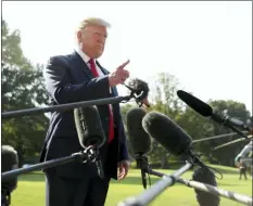  ?? ANDREW HARNIK — THE ASSOCIATED PRESS ?? President Donald Trump talks to the press before walking across the South Lawn of the White House, in Washington, Wednesday to board Marine One for a short trip to Andrews Air Force Base, Md., and then on to Dayton, Ohio, and El Paso, Texas, in the afternoon to praise first responders and console family members and survivors from two recent mass shootings.