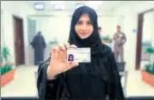  ?? AP ?? Tahani Aldosemani, an assistant professor at Prince Sattam Bin Abdulaziz University in Alkharj, displays her licence.