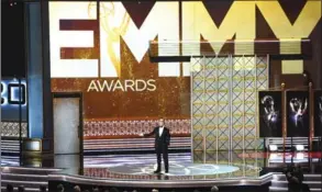  ??  ?? Host Stephen Colbert performs onstage during the 69th annual Primetime Emmy Awards at Microsoft Theater on Sunday in Los Angeles.