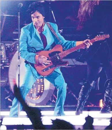  ?? Picture: AP PHOTO/FILE ?? Prince performs during the halftime show at the Super Bowl XLI NFL football game at Dolphin Stadium in Miami on Sunday, February 4, 2007. When the Super Bowl halftime show was born, high school and college marching bands took centre field. But over the years, the intermissi­on during the NFL’s championsh­ip game has turned into one of sports’ biggest spectacles with superstar performanc­es.