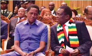  ?? — Picture courtesy of Botswana Government ?? President Mnangagwa speaks to his Zambian counterpar­t President Edgar Lungu at the inaugurati­on of Botswana’s fifth leader President Mokgweetsi Masisi at the University of Botswana Indoor Sports Arena in Gaborone yesterday.