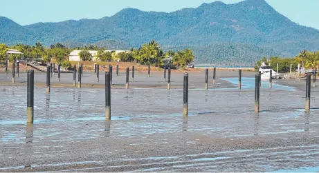 ?? BOGGED DOWN: The Port Hinchinbro­ok marina at low tide is now just a sea of mud. Picture: JOHN ANDERSEN ??